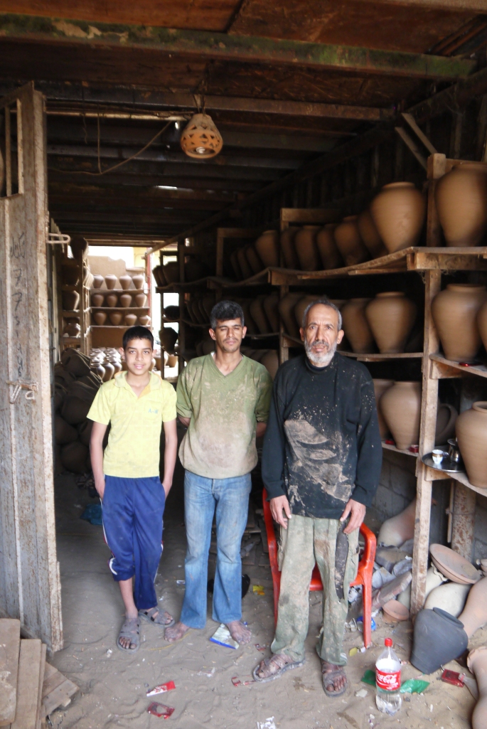 Mahmoud Attallah and his two son's in their pottery factory in the Old City of Gaza