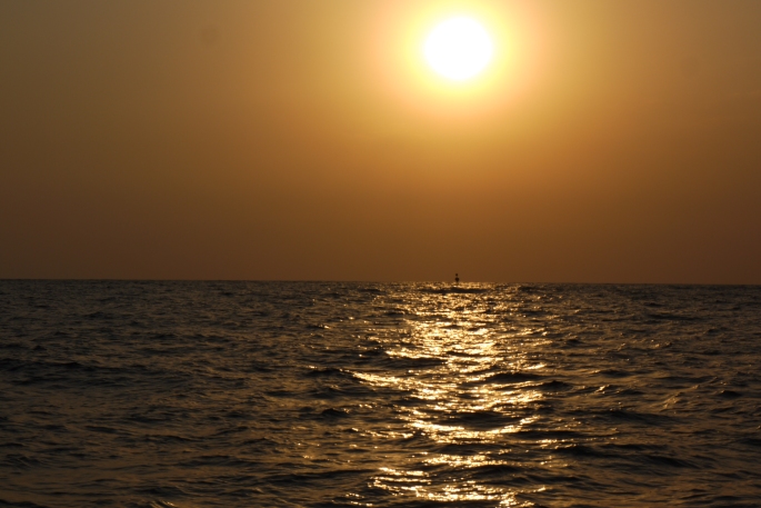 The sun setting over the three mile buoy off the coast of Gaza.
